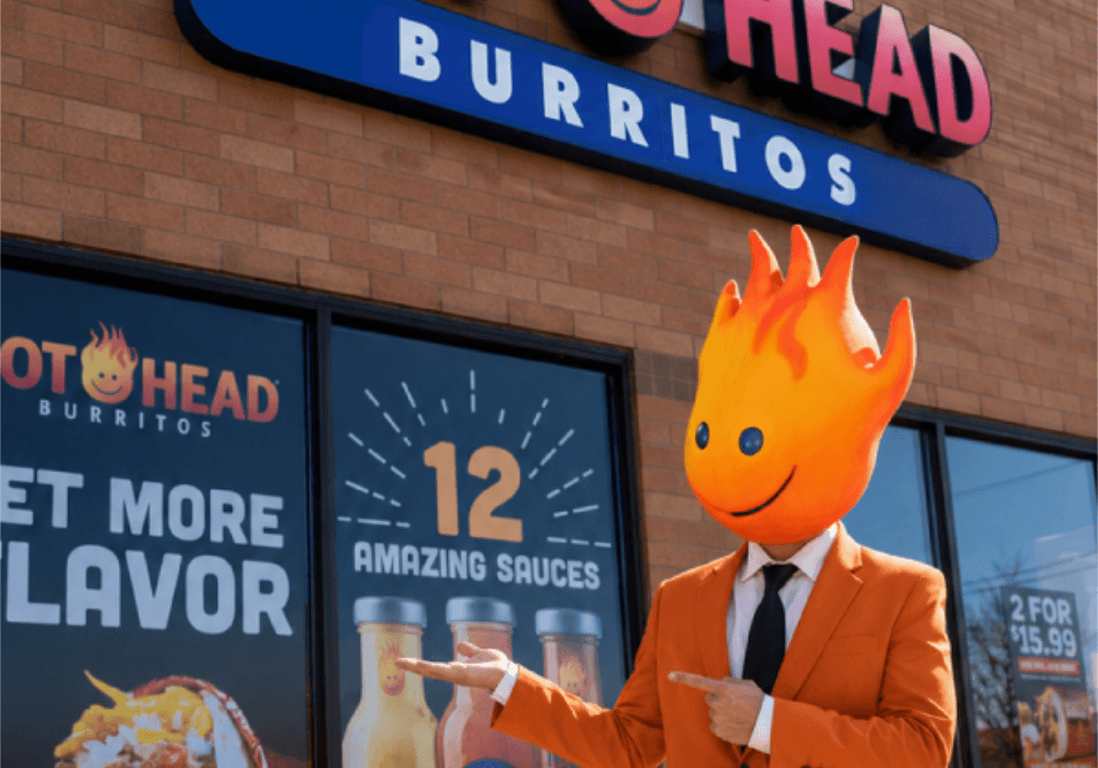 Smiling customer enjoying Hot Head Burritos, representing franchise success
